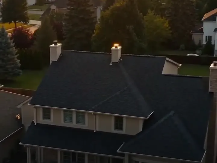 House with a newly shingled roof at sunset